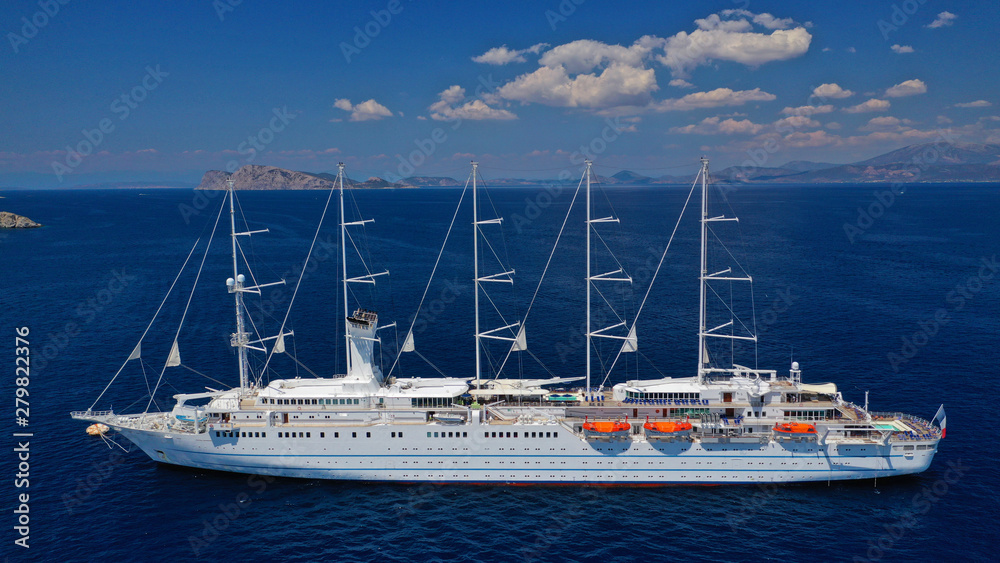 Aerial drone photo of classic cruise liner docked in deep blue Aegean sea Aerial drone photo of classic cruise liner docked in deep blue Aegean sea