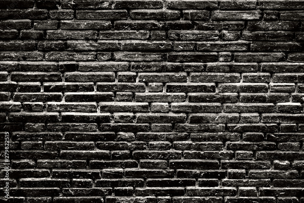 Obraz premium Grunge and dirty black bricks wall as the abstract textured and background