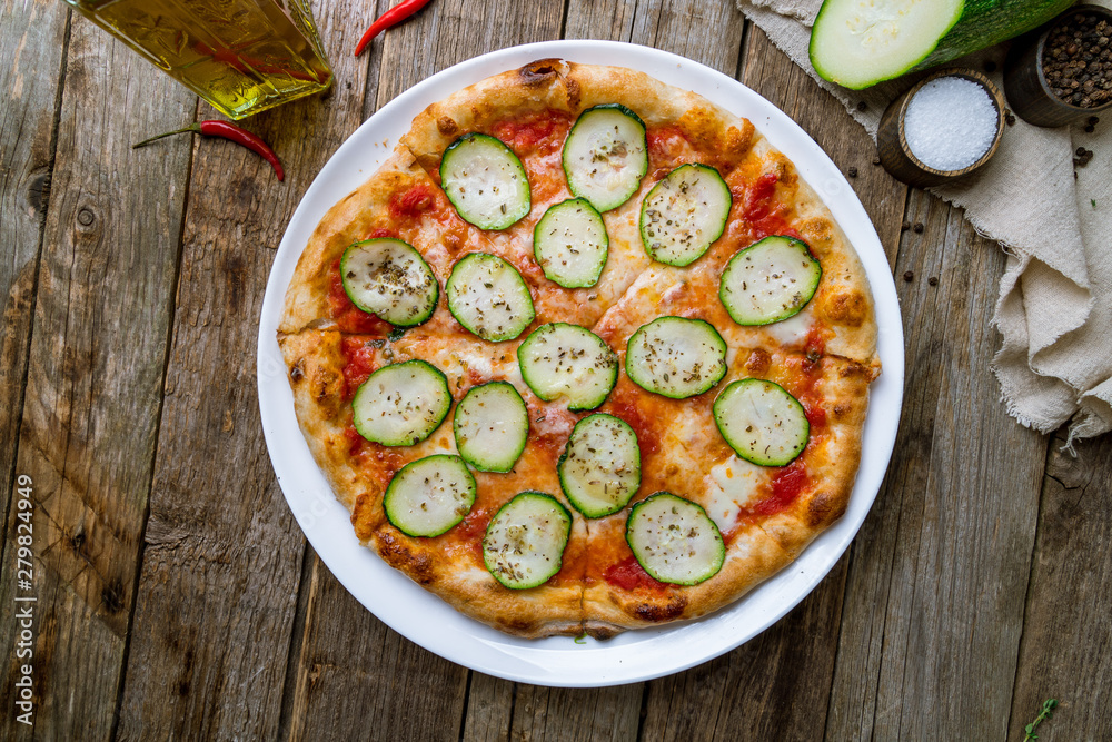 Pizza with vegetables vegetarian on wooden table Pizza with vegetables vegetarian on wooden table