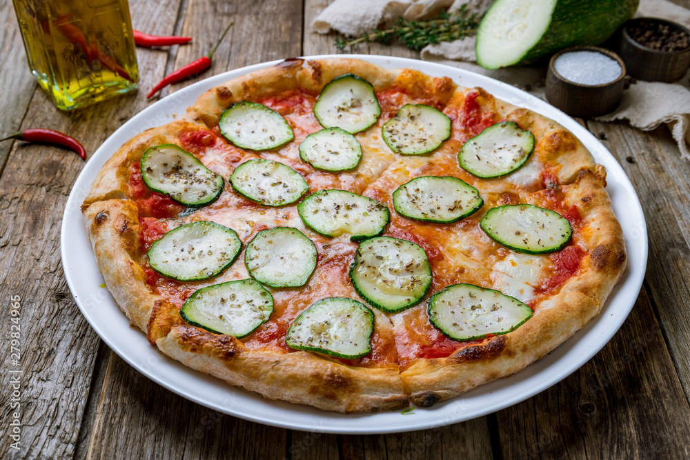 Pizza with vegetables vegetarian on wooden table Pizza with vegetables vegetarian on wooden table