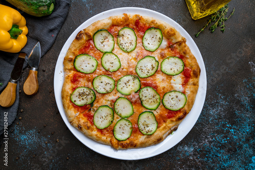 Pizza with vegetables vegetarian on dark concrete background