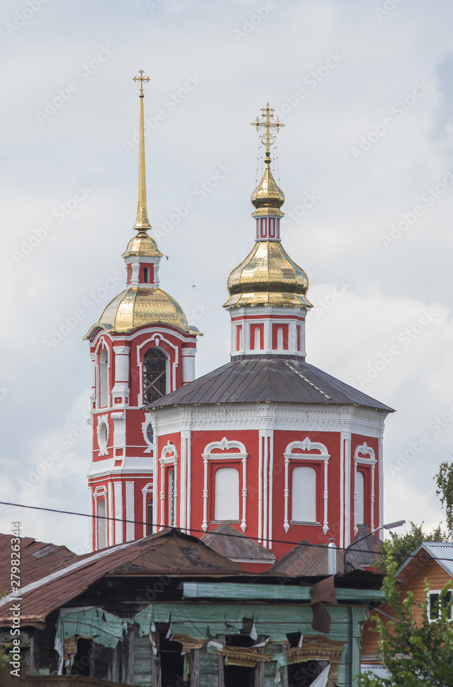 Big red Christian church in the village - Suzdal, Russia
