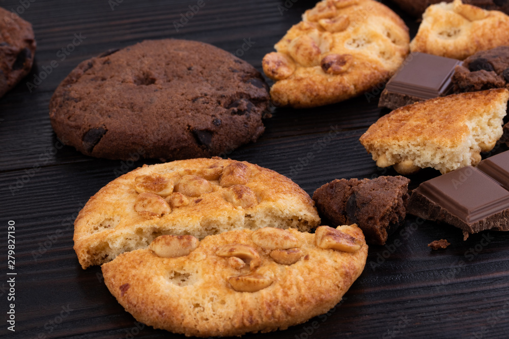 Chocolate cookies on wooden table. Homemade food on wooden background