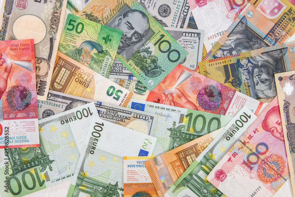 Colorful banknotes of different countries as background close up
