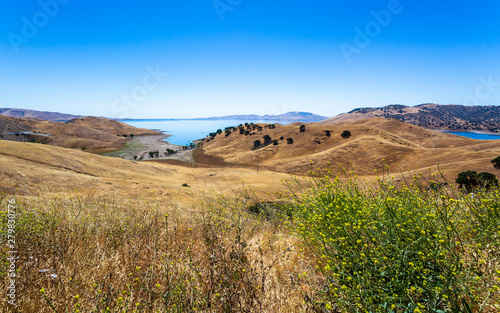 Driving through the golden hills of California; the San Luis Reservoir State Recreation area photo