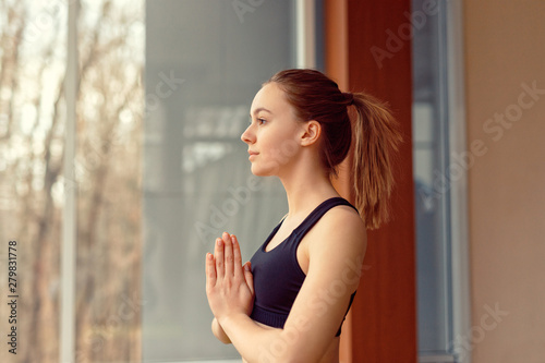 Young woman doing yoga in gym Free Download Young woman doing yoga in gym - GFXLoad