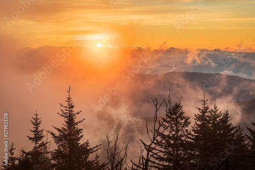 Sunrise with Solar halo and fog at Clingmans Dome of Great Smoky Mountains National Park, NC USA in autumn