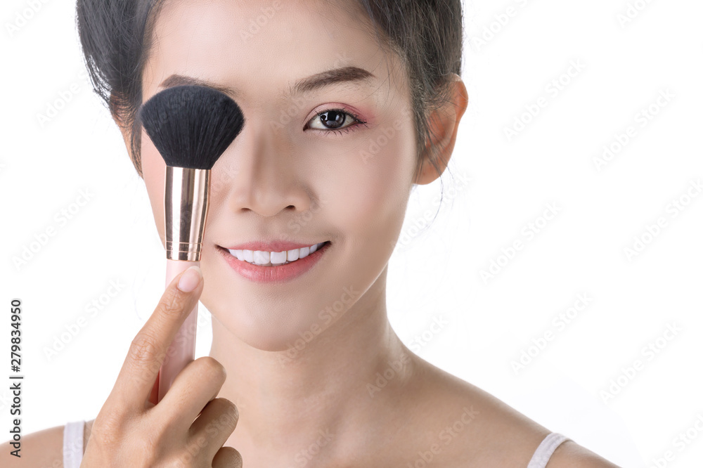 Beautiful Young Asian Woman using Soft Brush and Cosmetic on own face. Cosmetologist, Skin care or Beauty concept Beautiful Young Asian Woman using Soft Brush and Cosmetic on own face. Cosmetologist, Skin care or Beauty concept