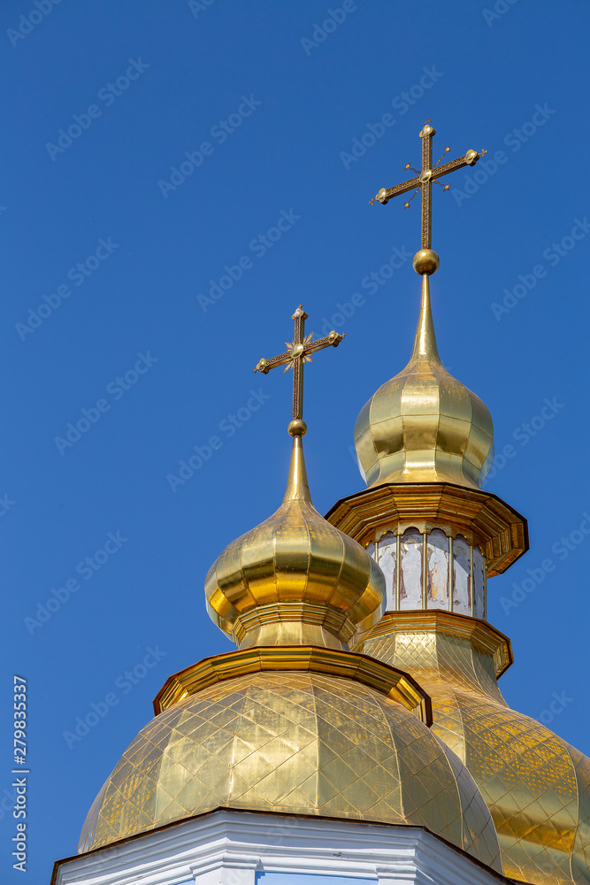 Golden domes on blue sky background of church on monastery of St. Michael in Kyiv, Ukraine