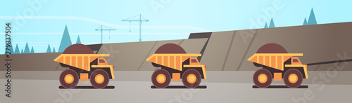 heavy yellow dumper trucks professional equipment working on coal mine production mining transport concept opencast stone quarry background flat horizontal