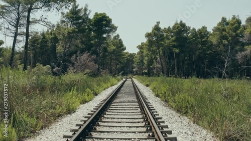 POV shot of a train on a rail in an exotic jungle surrounding on a hot summer day 4k 