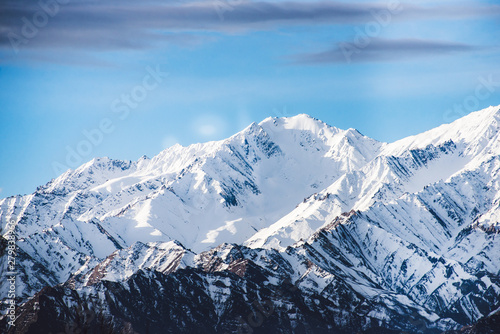 Beautiful snow-covered mountains in winter in sunny weather in Leh, Ladakh, India.