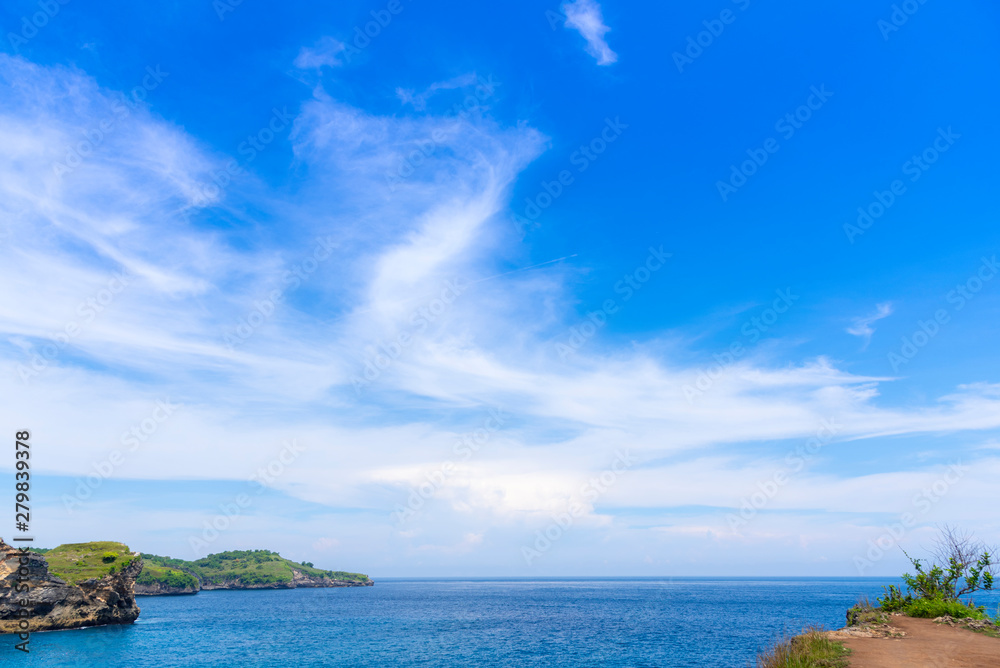 Silk sky blue ocean water and  rocky bay and blue sky apart of one day traval trip of the eastern in Nusa Penida island , Klingung regency, Bali Island, Indonesia