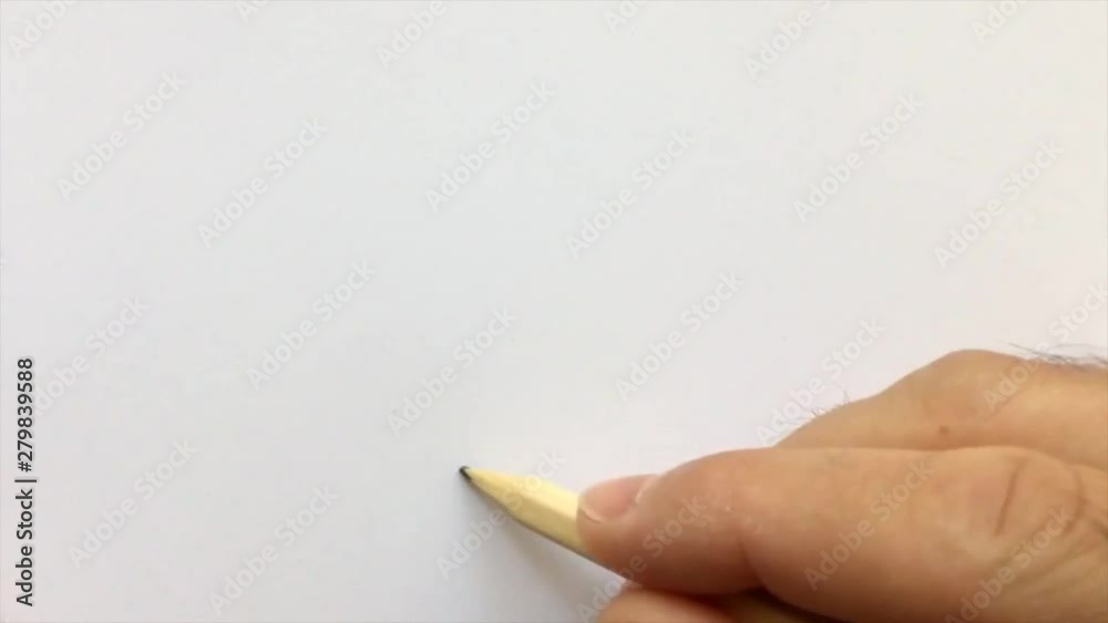 Writing the word blur with a wooden pencil on a white paper