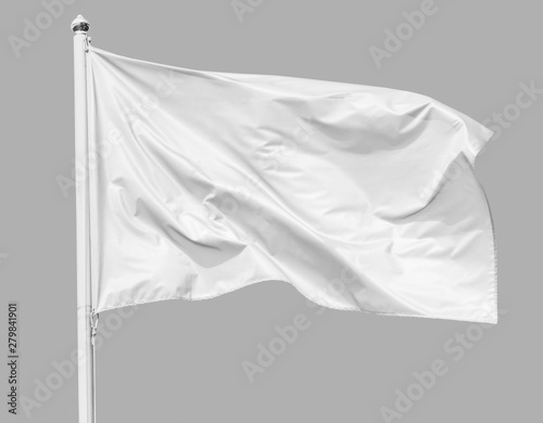 White flag waving in the wind on flagpole, isolated on gray background, closeup photo