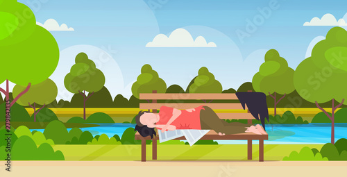 poor man sleeping outdoor drunk beggar lying on wooden bench homeless jobless concept urban park landscape background horizontal full length