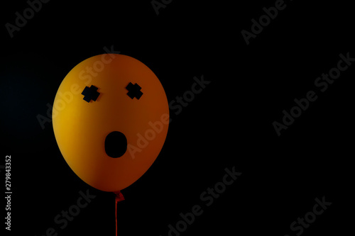 Scary air balloons for halloween over black background photo