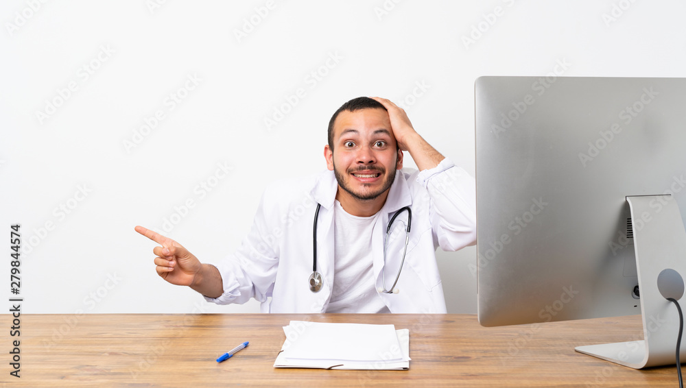Doctor Colombian man surprised and pointing finger to the side Doctor Colombian man surprised and pointing finger to the side