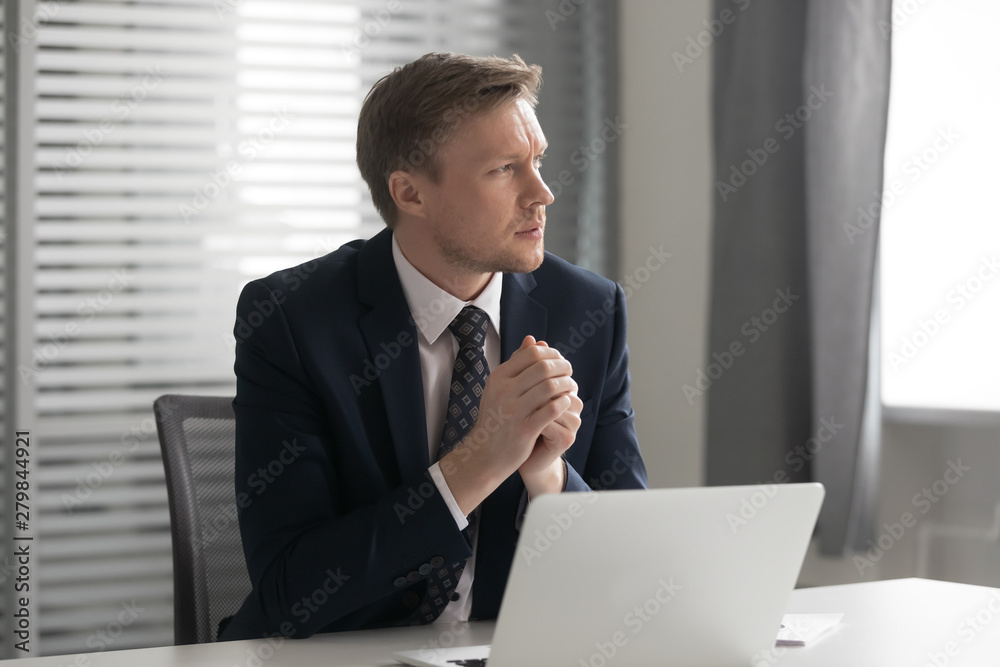 Serious thoughtful businessman feel doubtful concerned about business challenge Serious thoughtful businessman feel doubtful concerned about business challenge