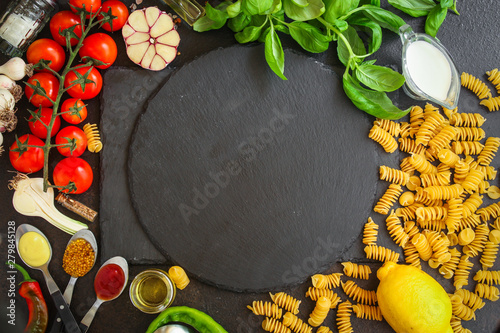 pasta Rotini, fusilli, radiatori (set of ingredients for making sauce). top food background. copy space