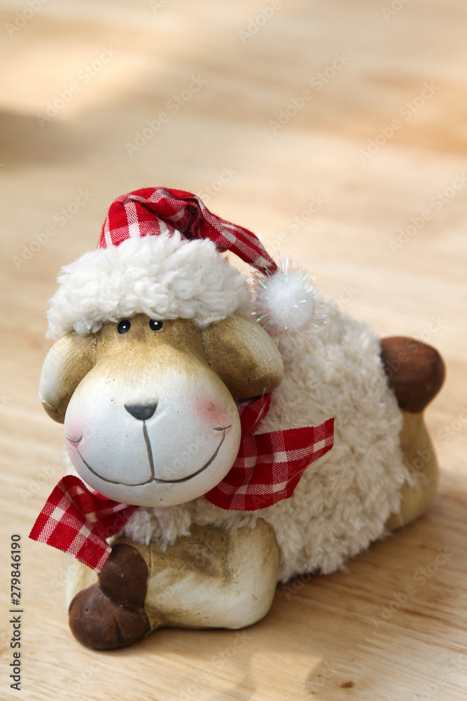 The smile teddy sheep on the wooden table. The smile teddy sheep on the wooden table.
