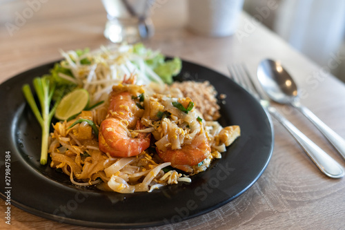 Fried noodle Thai style with prawns, Pad Thai Noodles with Shrimp in a restaurant