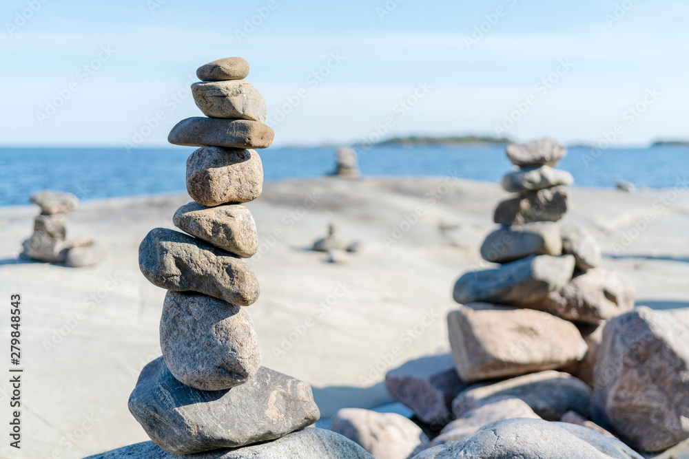 Stacked Rocks balancing, stacking with precision. Stone tower on the shore. Copy space. Stacked Rocks balancing, stacking with precision. Stone tower on the shore. Copy space.