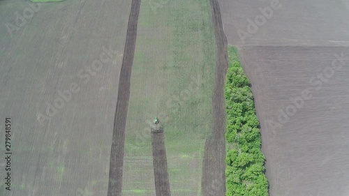 Kashan, Iran. Aerial view of a tractor working in the field. Agriculture of Iran. photo