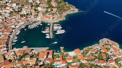 Fototapeta Naklejka Na Ścianę i Meble -  Aerial drone photo of picturesque port and main village of Hydra or Ydra island with beautiful neoclassic houses, Saronic gulf, Greece