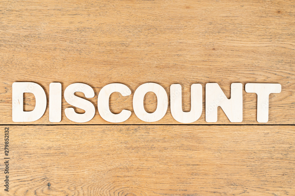 word discount of wooden letters on table word discount of wooden letters on table