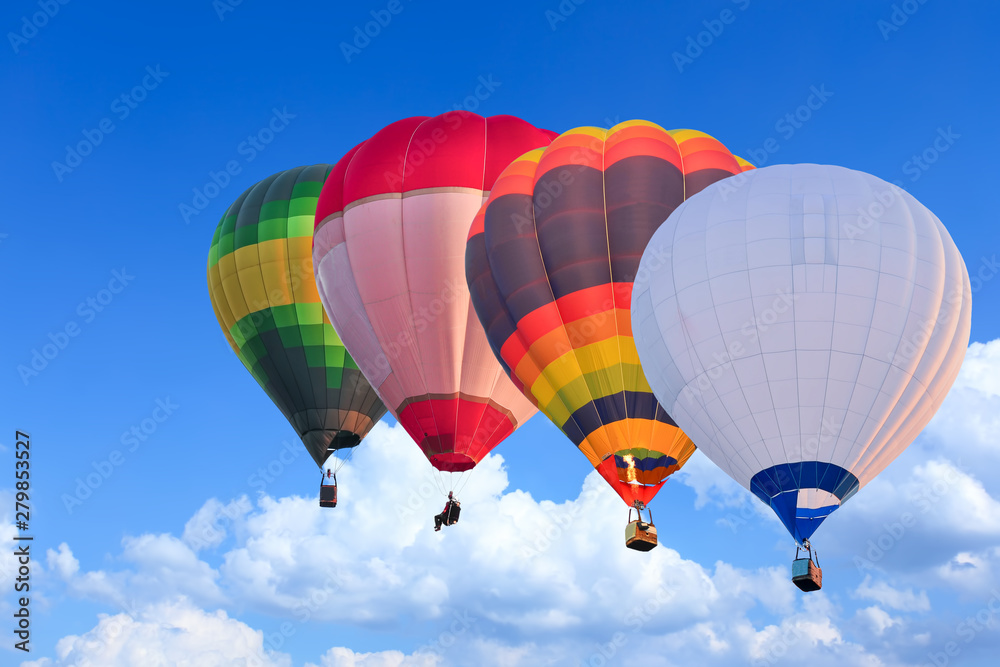 Fototapeta premium Colorful Hot Air Balloons in Flight over blue sky