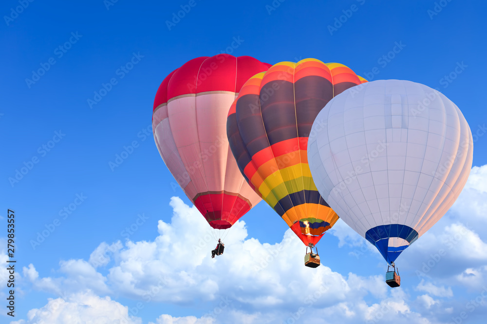 Colorful Hot Air Balloons in Flight over blue sky Colorful Hot Air Balloons in Flight over blue sky