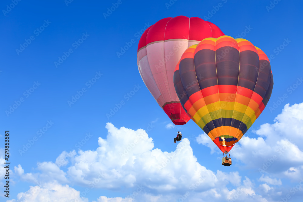 Naklejka premium Colorful Hot Air Balloons in Flight over blue sky
