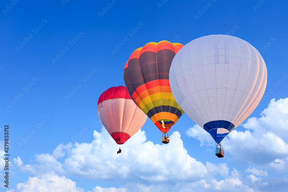 Colorful Hot Air Balloons in Flight over blue sky Colorful Hot Air Balloons in Flight over blue sky