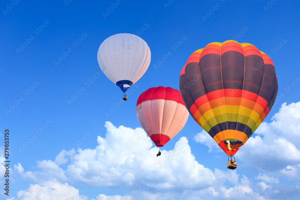 Colorful Hot Air Balloons in Flight over blue sky Colorful Hot Air Balloons in Flight over blue sky