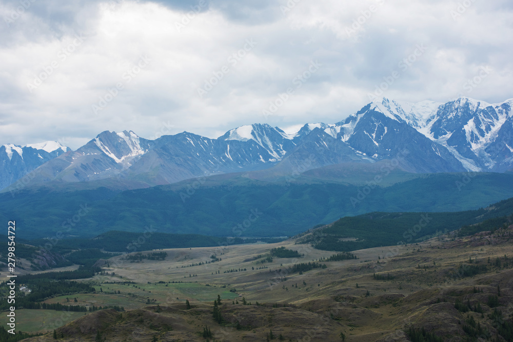 Fototapeta premium Summer in Kurai steppe and North-Chui ridge of Altai mountains, Russia. Cloud day.