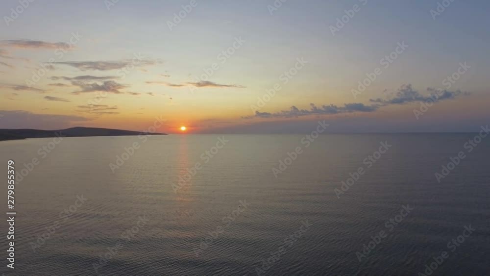 Sunset over sea. Golden reflections on sea water surface at sunset, aerial video, drone point of view, drone flying above the sea surface, close up Sunset over sea. Golden reflections on sea water surface at sunset, aerial video, drone point of view, drone flying above the sea surface, close up