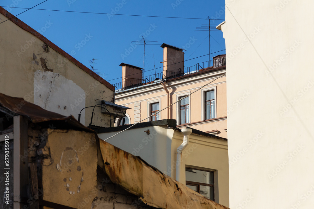 variety of roofs and walls of urban residential buildings. view of the old facades below. Saint-Petersburg, Russia