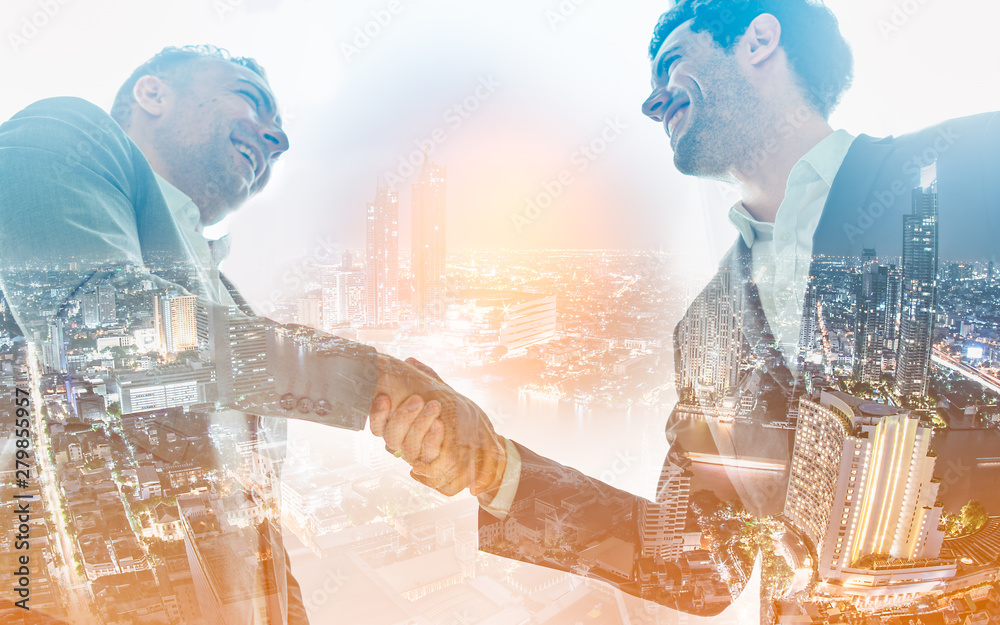 Double exposure of worker hand shake teamwork brainstorming with innovation business. concept success investment.Business People Handshake Greeting Deal Concept.