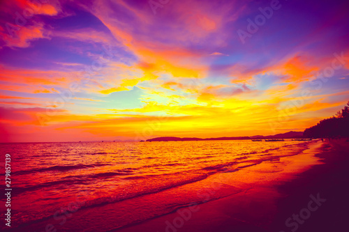 Fototapet Amazing fairy tale colorful sunset over the calm ocean surface next to the exotic tropical islands in the kingdom of Thailand