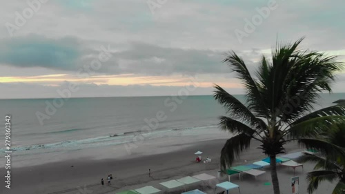 Sutset on beach with palm trees, aerial shot photo