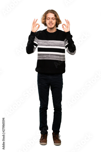 Full-length shot of Blonde man in zen pose over isolated white background