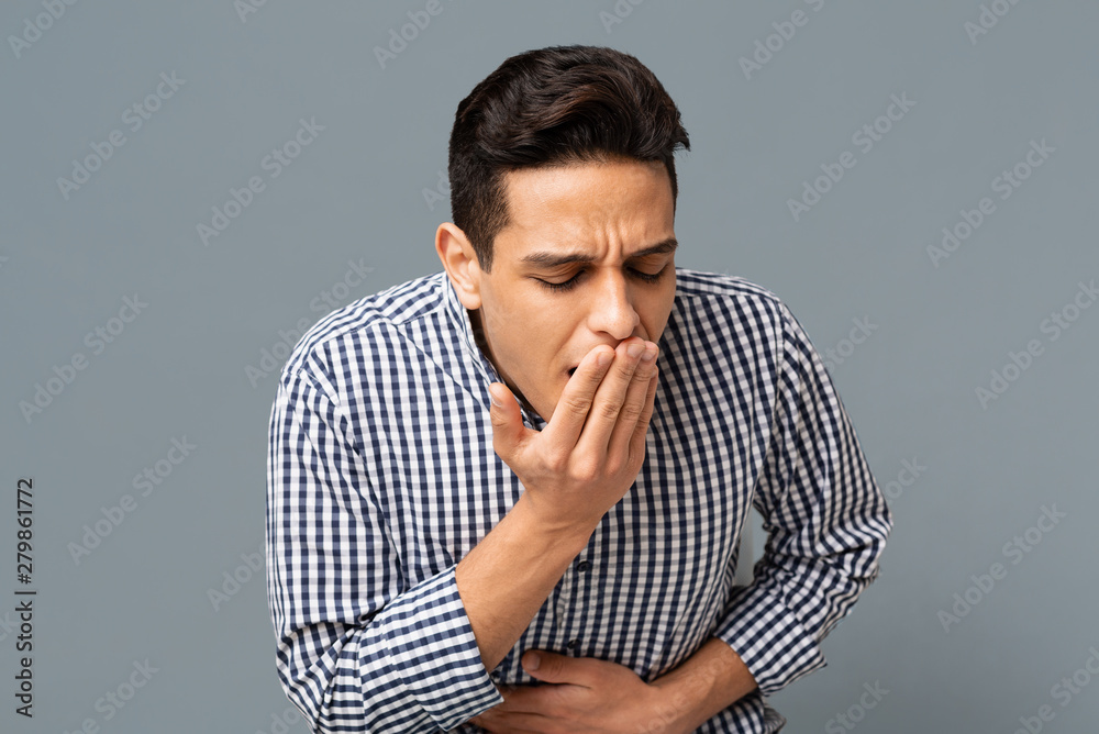 Man Feeling Sick And Nauseous On Gray Background Man Feeling Sick And Nauseous On Gray Background