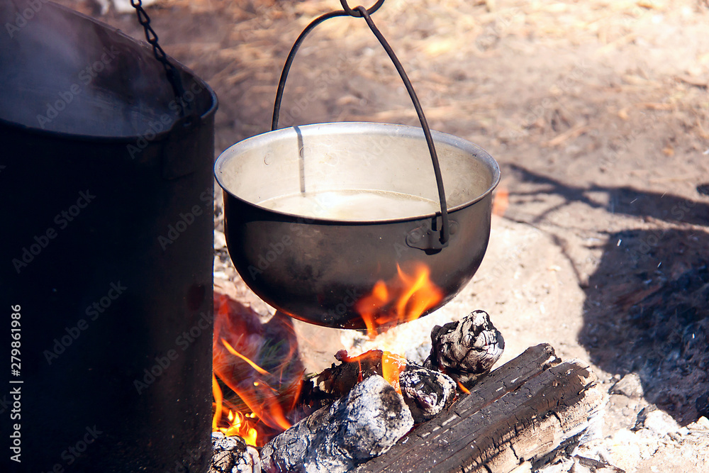 Cooking in a camping trip, outdoor kitchen. Cooking in a camping trip, outdoor kitchen.