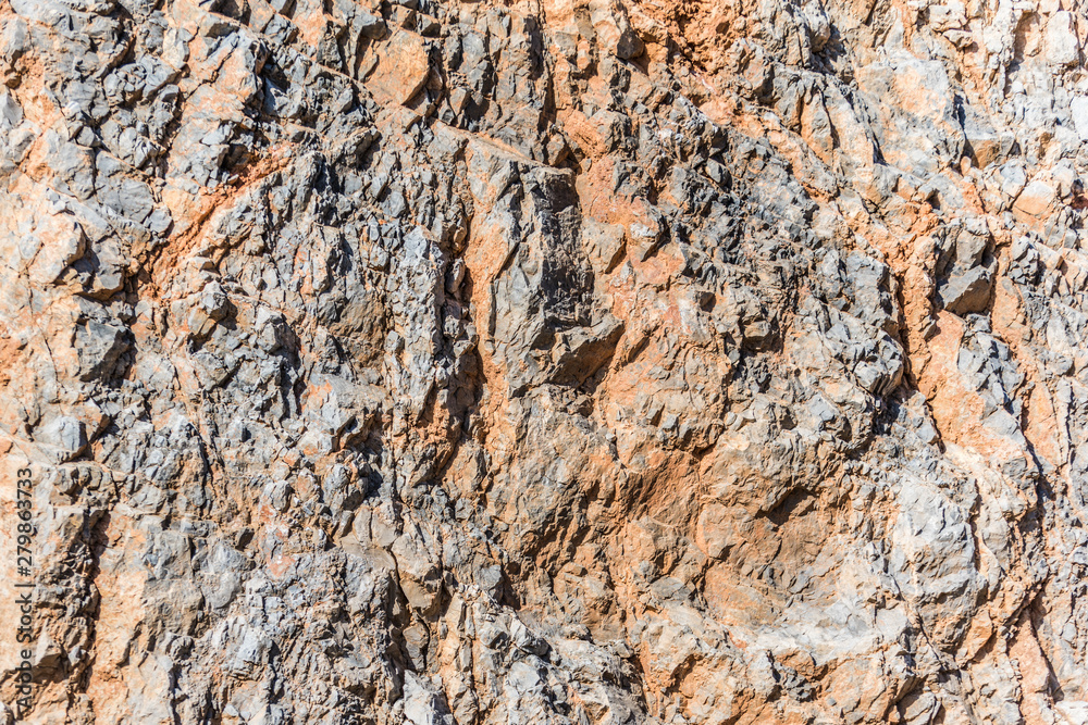 background and texture of mountain layers and cracks in sedimentary rock on cliff face. Cliff of rock mountain. background and texture of mountain layers and cracks in sedimentary rock on cliff face. Cliff of rock mountain.