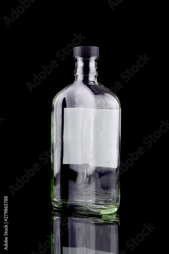Empty bottle isolated in black
