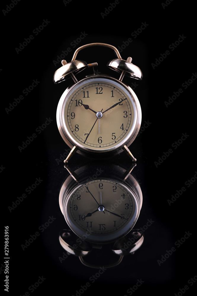 Alarm clock isolated on a black background Alarm clock isolated on a black background