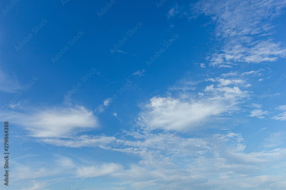 A view of a majestic blue sky with beautiful white clouds A view of a majestic blue sky with beautiful white clouds