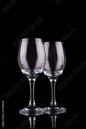Empty wine glass isolated on black
