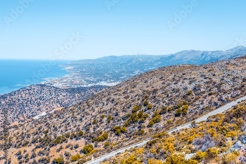 Top view from the autumn mountains to the village of Malia, roads and the nearby villages of the field and the Aegean Sea. Crete, Greece